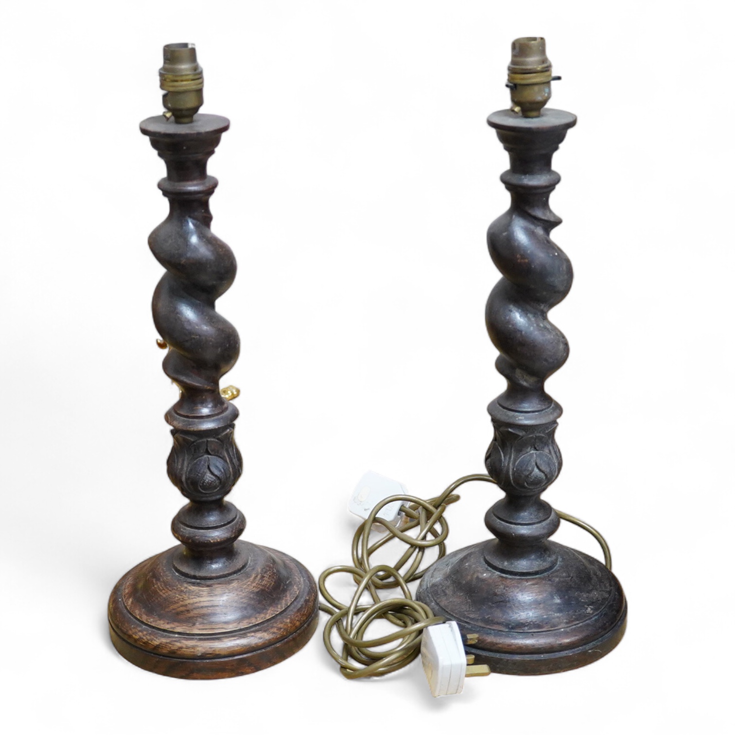 A pair of carved oak barley twist table lamps, 42cm